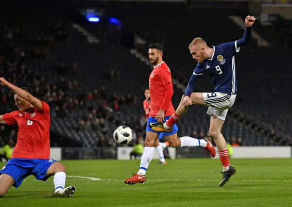 Scotland debutant Oli McBurnie takes a shot at goal. Picture: Rob Casey/SNS