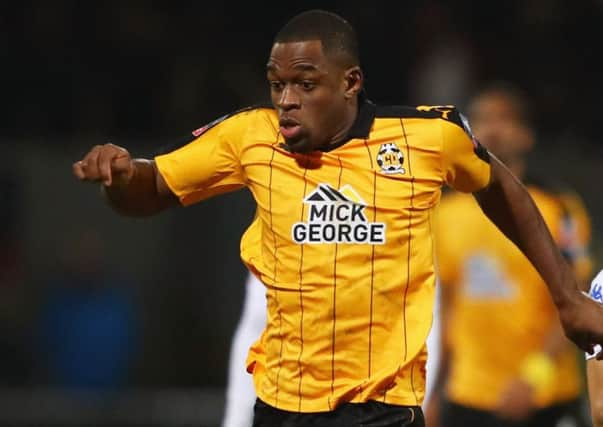 Uche Ikpeazu, left, in action for Cambridge United, is set to sign a pre-contract with Hearts. Picture: Clive Mason/Getty Images