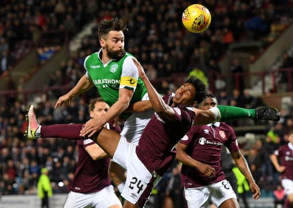 Darren McGregor heads a chance wide under pressure from Demetri Mitchell. Picture: SNS Group