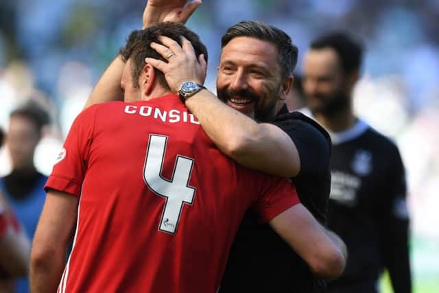 Aberdeen manager Derek McInnes celebrates with match-winner Andrew Considine. Picture: SNS