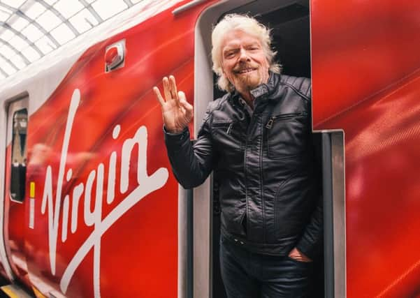 Sir Richard Branson unveiling the Virgin Azuma, the first of their new fleet designed to  cut journey times on the East Coast Main Line. Picture: Mikael Buck/Virgin Trains/PA Wire