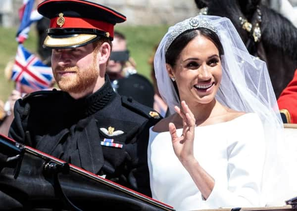 Meghan and Harry delighted fans as they sat in an open-top Ascot Landau for a carriage procession. Picture: AFP/Getty