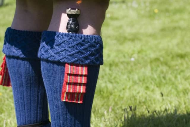 Joy for Canadian bagpiper charged over Sgian Dubh in sock