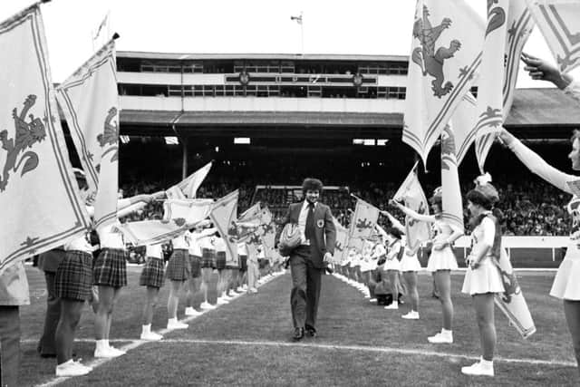 Scotland World Cup team player Derek Johnstone with majorettes at Hampden Park before the team go to Argentina in May 1978