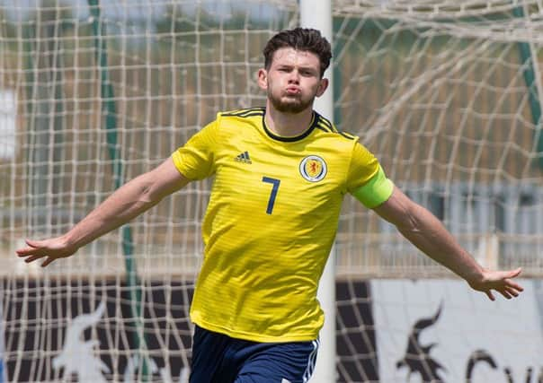 Scotland's forward and captain Oliver Burke celebrates after netting a spectacular solo goal against South Korea. Picture: AFP/Getty