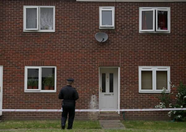 Police at the scene in Swinfield Close, Hanworth, west London where a mother and baby were stabbed on Monday evening. Picture: PA Wire