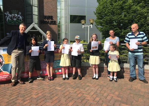 MSP Willie Rennie and parents and school children.