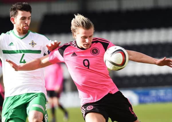 Motherwell's new signing Liam Donnelly challenges Jason Cummings. Picture: SNS/Bill Murray