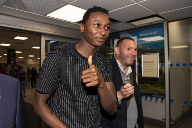 Umar Sadiq arrives at Edinburgh airport. Picture: SNS