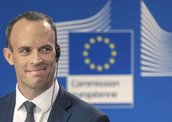 Dominic Raab listens as the EU's chief Brexit negotiator, Michel Barnier, pours cold water on the customs plan in the UK government's white paper. Photograph:  Olivier Matthys/AP