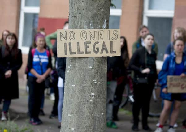 Protesters in Brand Street, Glasgow, outside the Home Office. (Picture: John Devlin)