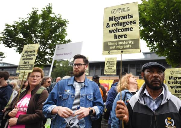 Protestors gathered outside Serco's office in Glasgow. Picture: John Devlin