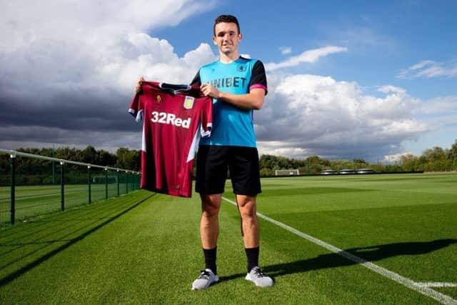 Midfield maestro John McGinn shows off his new playing kit after Aston Villa took advantage of Celtics dithering.