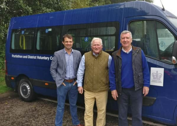 Pictured (from left) are  Andrew Bowie, Councillor Colin Pike and ambulance chairman Colin Stratton.