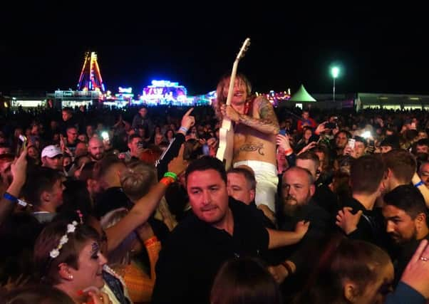 The Darkness   frontman  Justin Hawkins amongst the Dalkeith crowd. Photo by Alan Wilson.