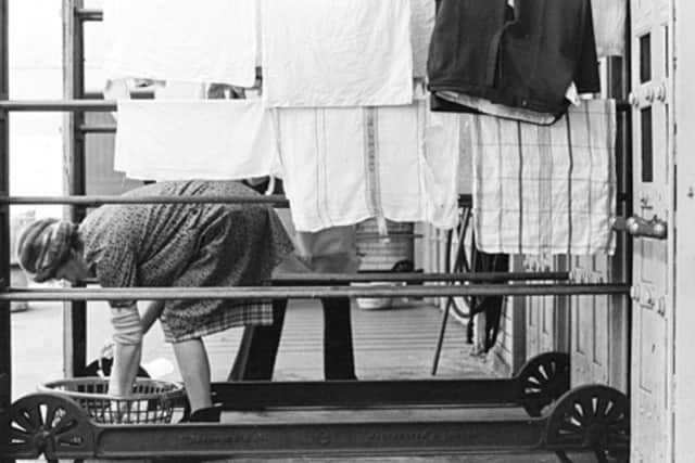 A woman at work at Lochrin Washhouse in Edinburgh in 1977. PIC: Brian Scotchburn Snell.