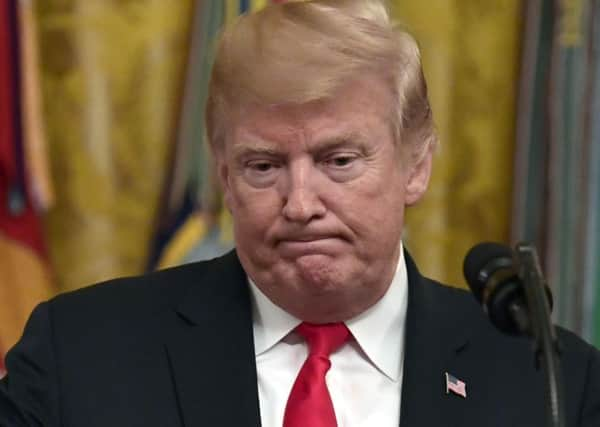 President Donald Trump speaks during a reception in the East Room of the White House in Washington (AP Photo/Susan Walsh)