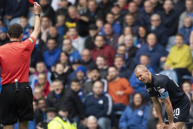 Kenny Miller is sent off by Kevin Clancy for his challenge on Borna Barisic. Picture: SNS Group