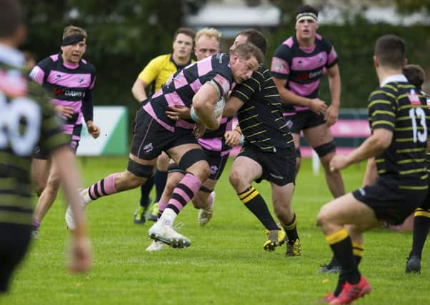 Blair MacPherson, with the ball, scored a try in Ayrs victory, in his first outing as captain for the league leaders. Picture: SNS/SRU