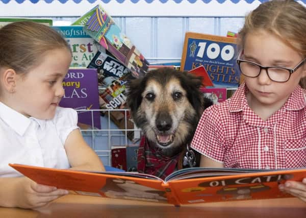 Russell visits the children. Picture: SWNS