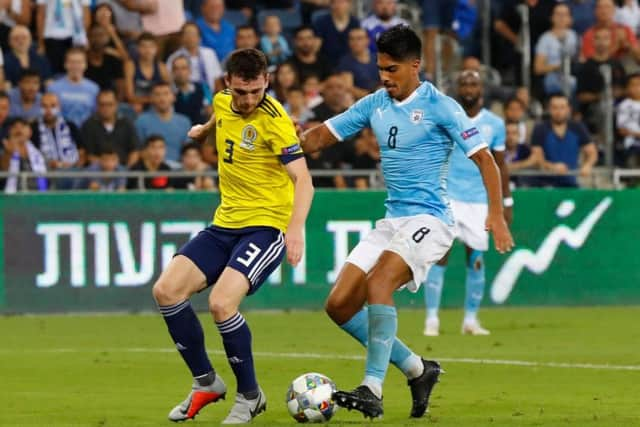 Scotland's Andrew Robertson battles with Israel midfielder Dor Peretz. Picture: AFP