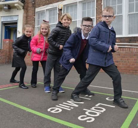 A mile is often several laps round a playground. Picture: Jon Savage