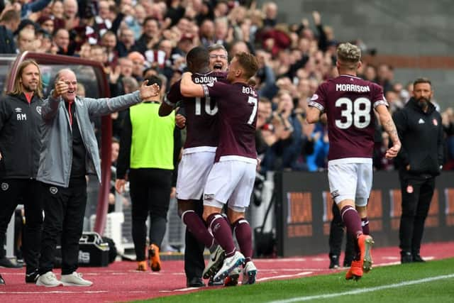 Hearts manager Craig Levein celebrates Arnaud Djoum's opener at Tynecastle. Picture: SNS