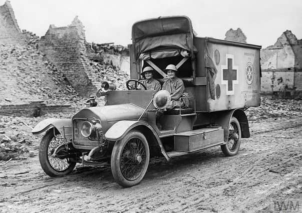 Â© IWM (Q 2660) Elsie Knocker, the Baroness de T'Serclaes, and Mairi Chisholm (The Madonnas of Pervyse) driving their motor ambulance through the ruins of Pervyse, 30th July 1917.