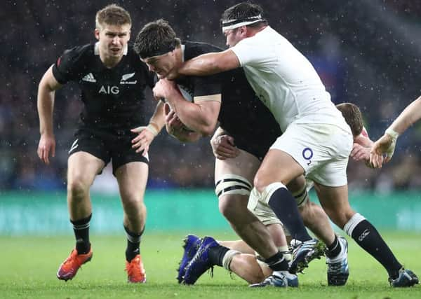 Scott Barrett of the All Blacks is tackled. Pic: Phil Walter/Getty Images