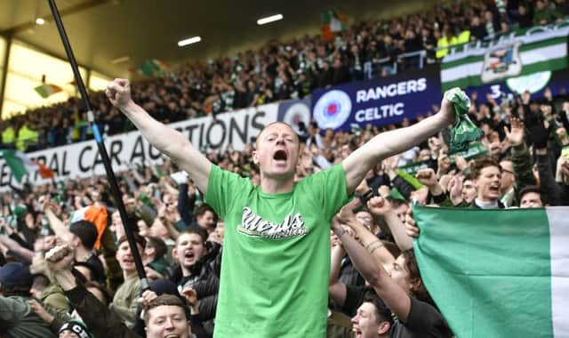 Celtic fans celebrate in the Broomloan Stand after the 3-2 win at Ibrox last season. Picture: SNS