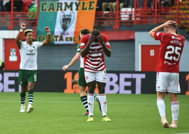 Despair for Hamilton's Scott Martin, right, as Celtic winger Scott Sinclair celebrates his own goal. Picture: Craig Foy/SNS