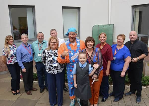 Staff from University Hospital Wishaw and Serco with Ian Sheepie Smith.