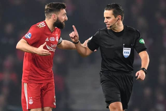 Aberdeen's Graeme Shinnie berates referee Andrew Dallas during the Betfred Cup final. Picture: SNS