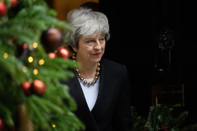 British Prime Minister Theresa May walks from number 10, Downing Street.(Photo by Leon Neal/Getty Images)