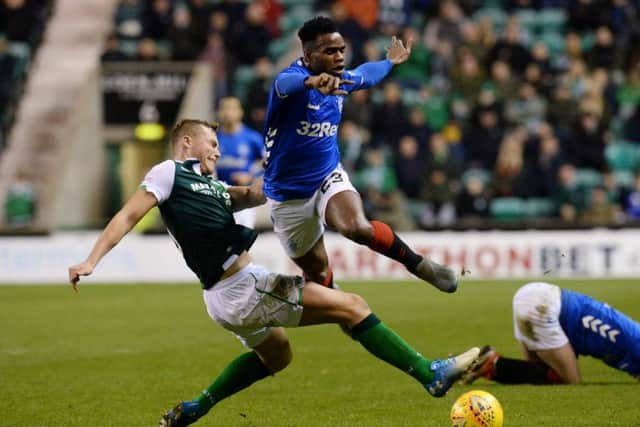 Hibs defender Ryan Porteous tackles Rangers' Lassana Coulibaly. Picture: SNS