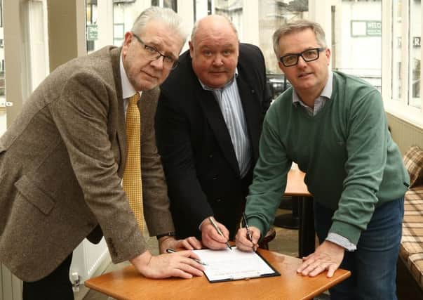 Michael Russell MSP, Jim Findlay Councillor Argyll and Bute Council and Brendan O'Hara MP sign the petition. Picture Kevin McGlynn