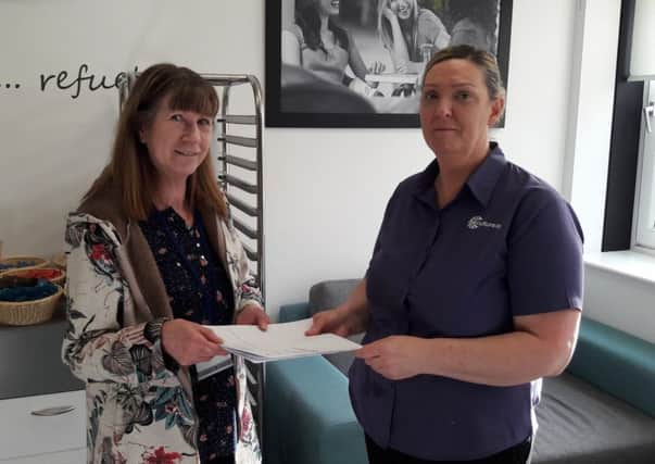 Helen McKinnon (right) presents to the petition to Motherwell West councillor Annette Valentine