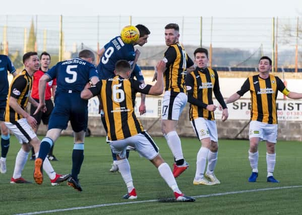 Partick Thistle's Steven Anderson opens the scoring with a header. Pic: SNS/Bruce White