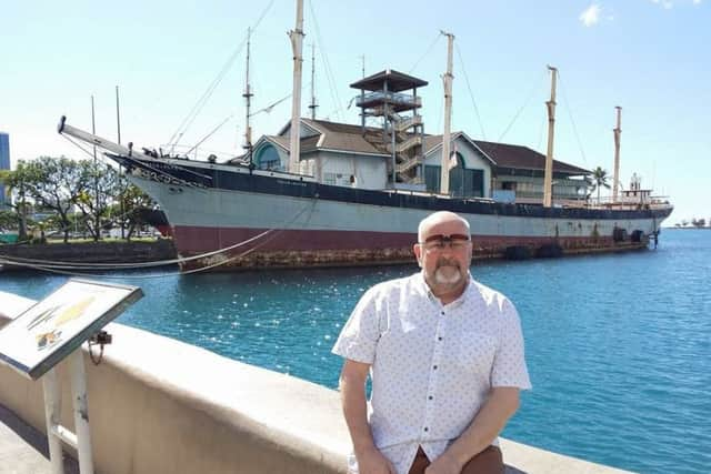 David O'Neill with the Falls of Clyde ship. Picture: SWNS