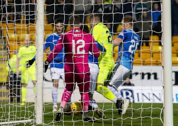 Hibs Florian Kamberi won a penalty for this challenge by Liam Craig. The striker angered Saints' Murray Davidson by his reaction. Picture: SNS.