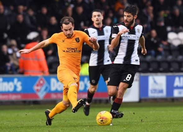 Livingston's Scott Pittman battles with St Mirren's Ryan Flynn. Pic: SNS/Paul Devlin