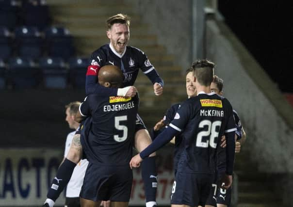 Defender Jordan McGhee celebrates scoring the opener. Picture: SNS.