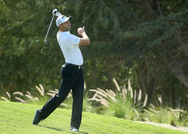 Oliver Wilson plays his second shot into the 10th green at Doha Golf Club. Picture: Warren Little/Getty Images