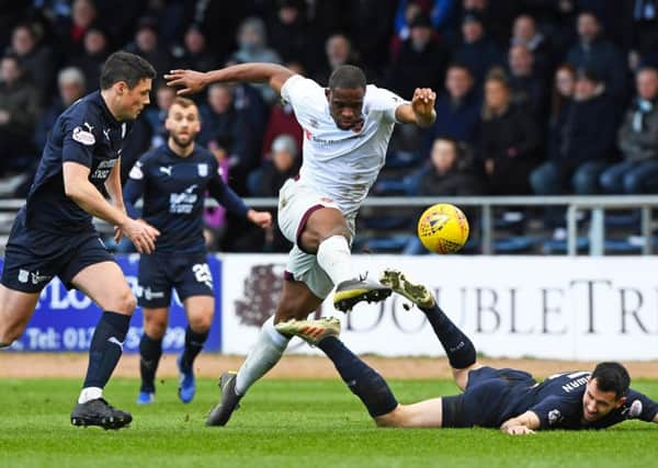 Hearts Uche Ikpeazu powers his way through the Dundee defence during Saturdays 1-0 victory. Picture: SNS.