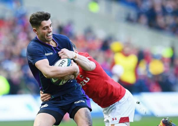 Adam Hastings is tackled by Dan Biggar. Picture: SNS Group