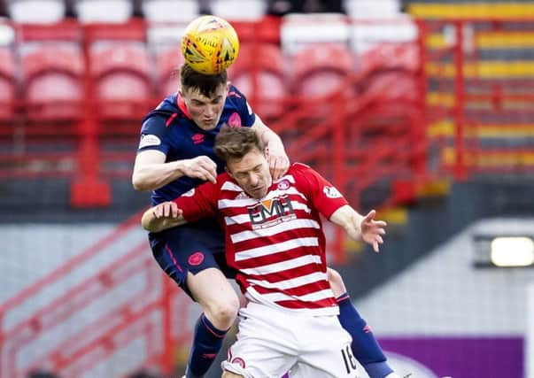 Hearts' John Souttar outjumps David McMillan of Hamilton for a header. Picture: SNS.