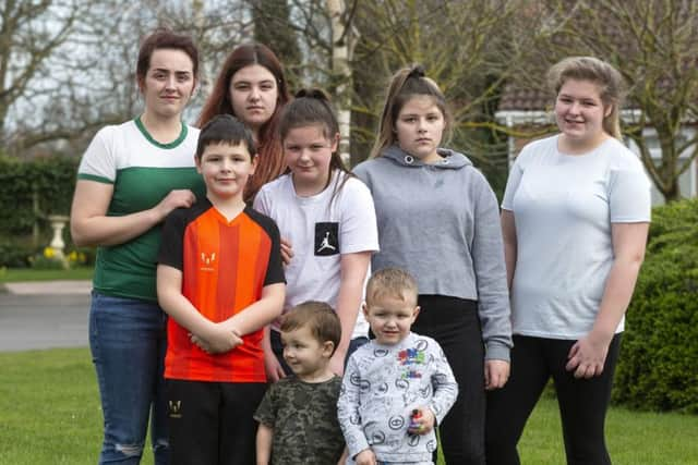 *

L-R Shannon Ellis, 23, Blaine Ellis, 8, Mia Ellis, 16, Keevie Ellis, 10, Rowan Ferguson, 2, Harrison Ferguson, 3, Bracken Ellis, 12, and Neve Ellis, 15. Picture: SWNS