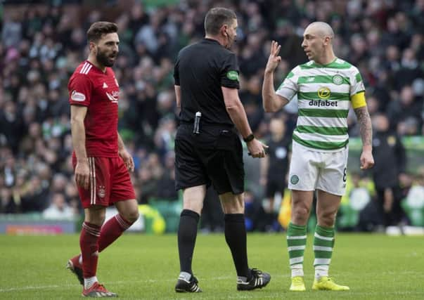 Celtic's Scott Brown will come up against Aberdeen's Graeme Shinnie. Picture: SNS/Craig Foy