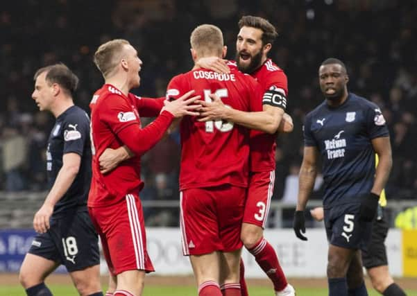 Aberdeen's Sam Cosgrove celebrates with Graeme Shinnie and Lewis Ferguson. Pic: SNS/Ross Parker