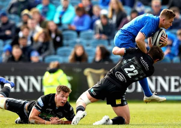 Leinsters Jordan Larmour is halted by a tackle from Glasgow Warriors Peter Horne during the visitors 39-24 victory in Dublin. Picture: Rex/Shutterstock